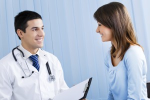 Doctor and patient with prescription at office