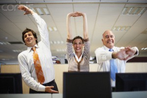 Businesspeople Stretching --- Image by © Randy Faris/Corbis